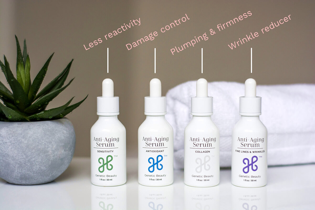 Anti aging skincare serums displayed on a white table as a part of Genetic Beauty review