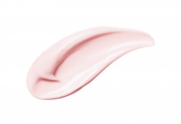 Pink stroke of anti aging skincare product on white background