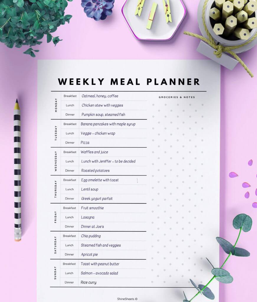 Weekly Meal Planner Template on the table with pencils