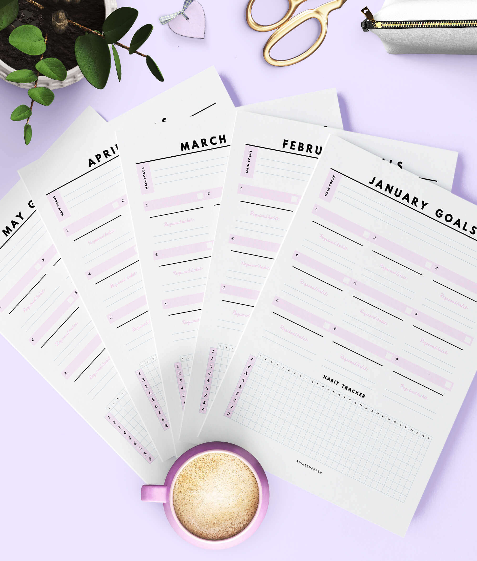 printable goal planners printed on table