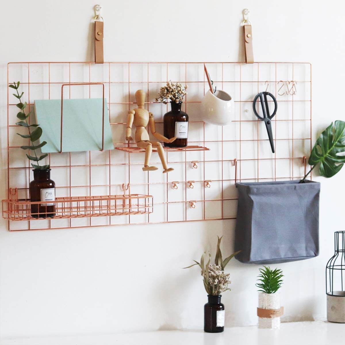 rose gold wall panel with random things as an idea of how to get organized