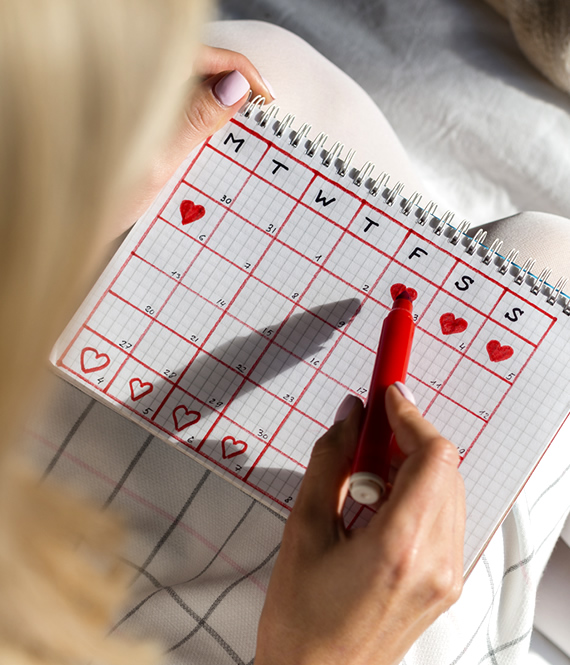 woman tracking her period with a diy period tracker