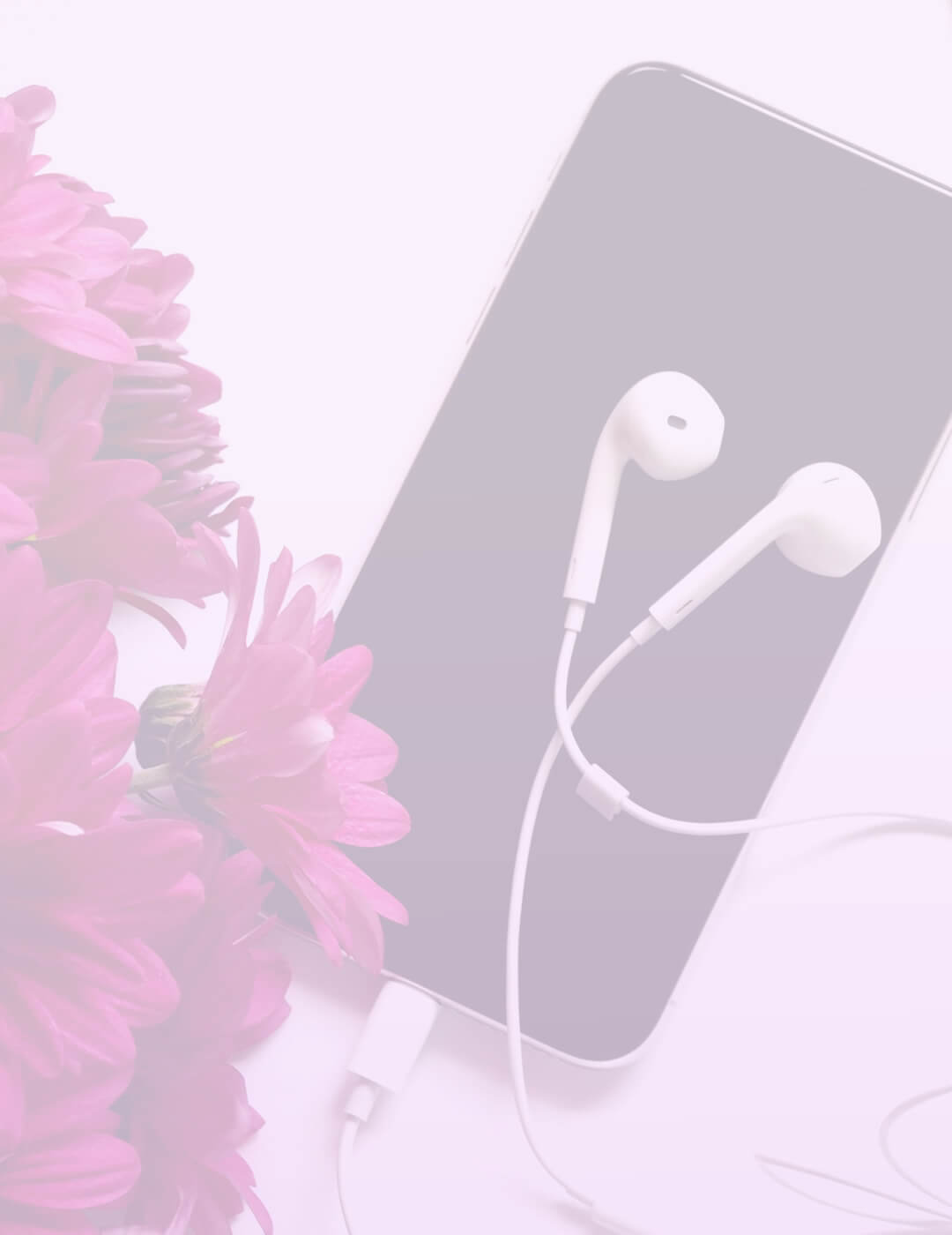phone earphones and flowers on the table