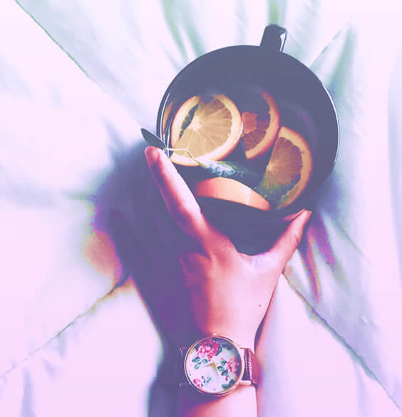 woman holding a cup od tea on her get your life together day