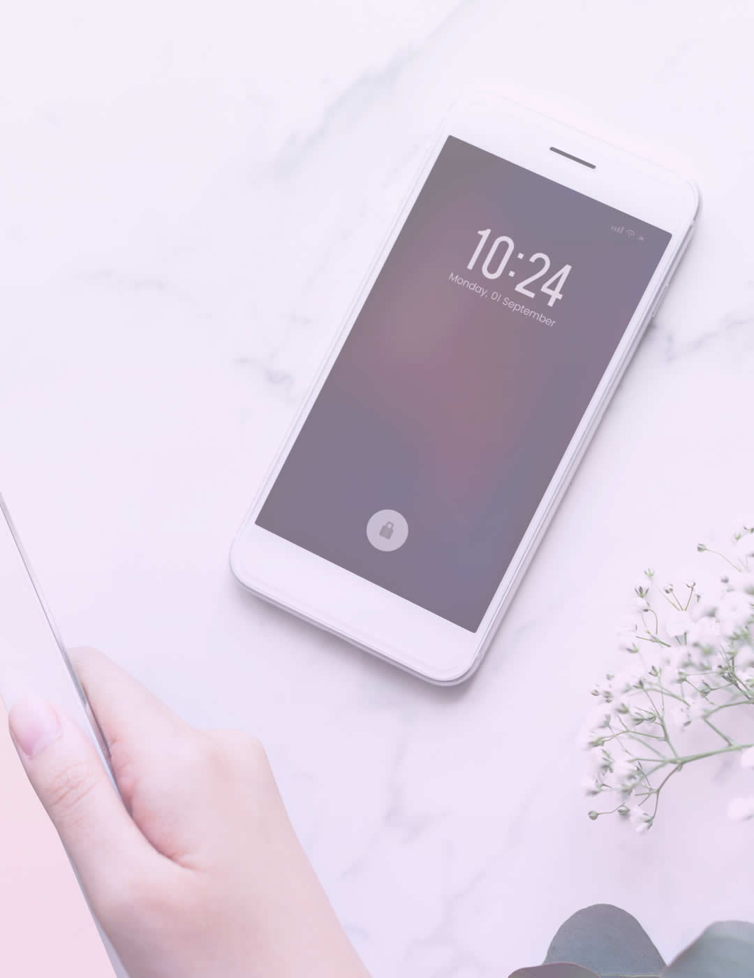 woman reading a book while her phone is set aside