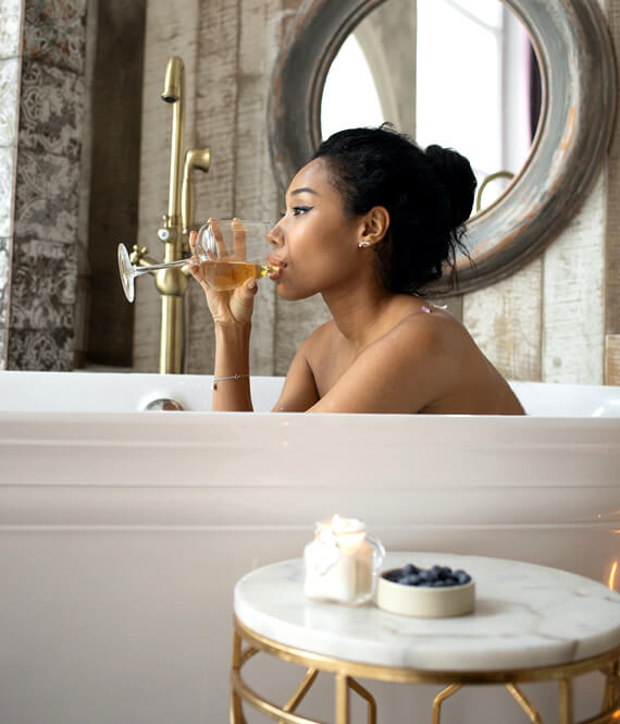 pretty ethnic woman having a self care bath
