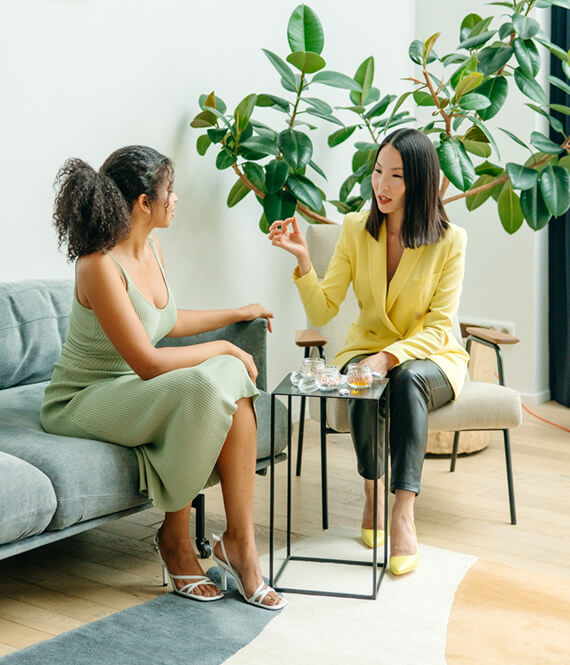 pretty woman talking and dumping her problems on another woman
