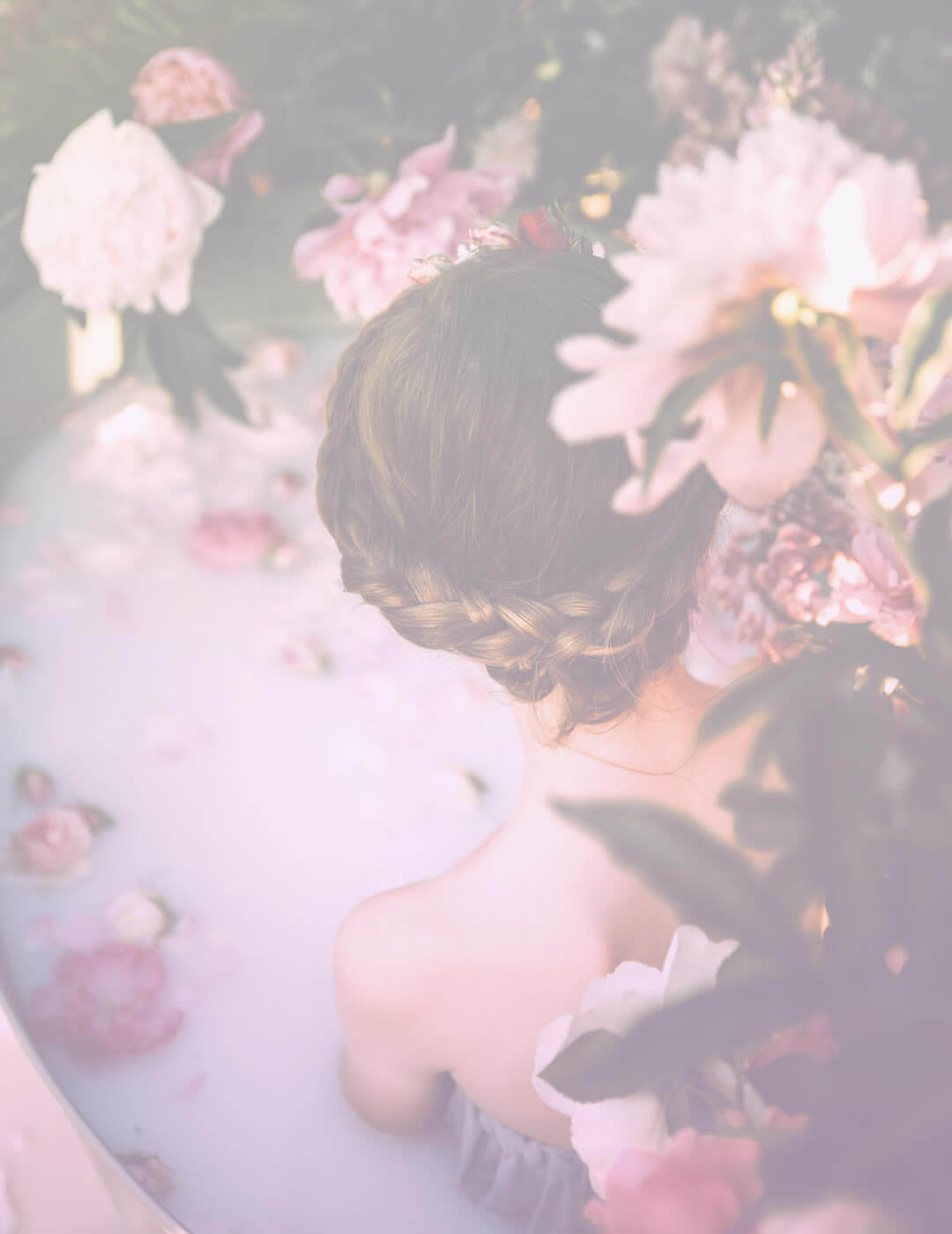 woman taking a milk bath with flowers