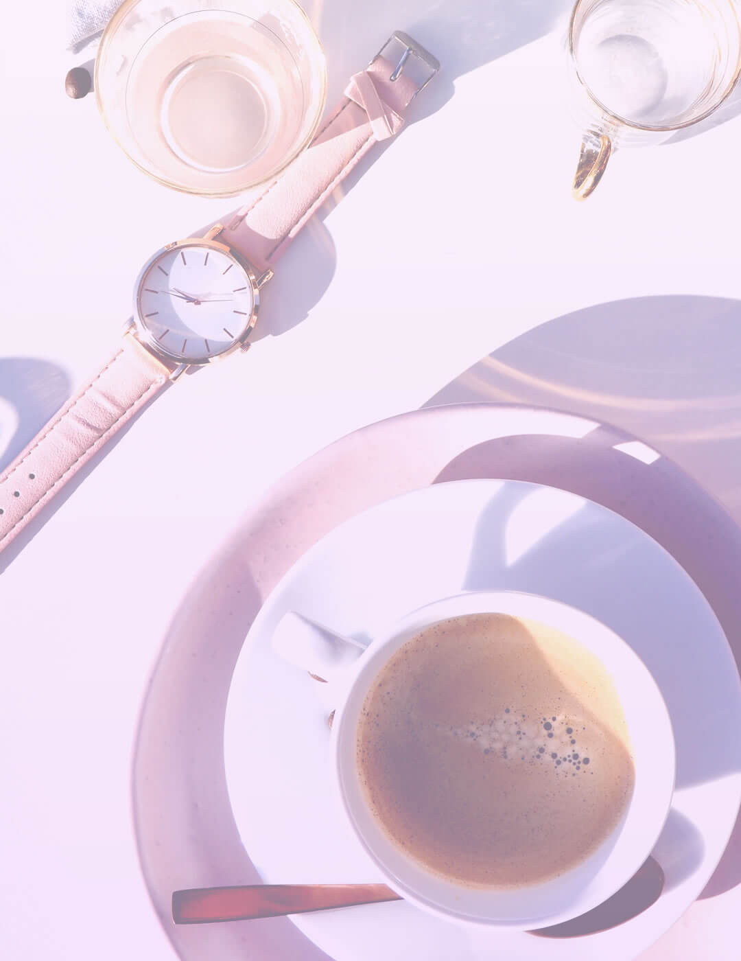 a cup of coffy and a watch as tools to improve work efficiency
