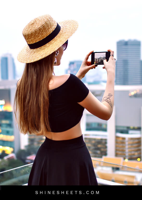 ellegant woman on the rooftop learning to enjoy life through experiences