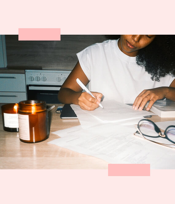 woman writing on printable planners