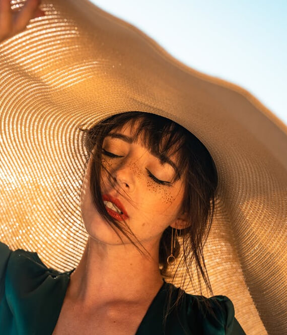 woman wearing sunscreen on her face