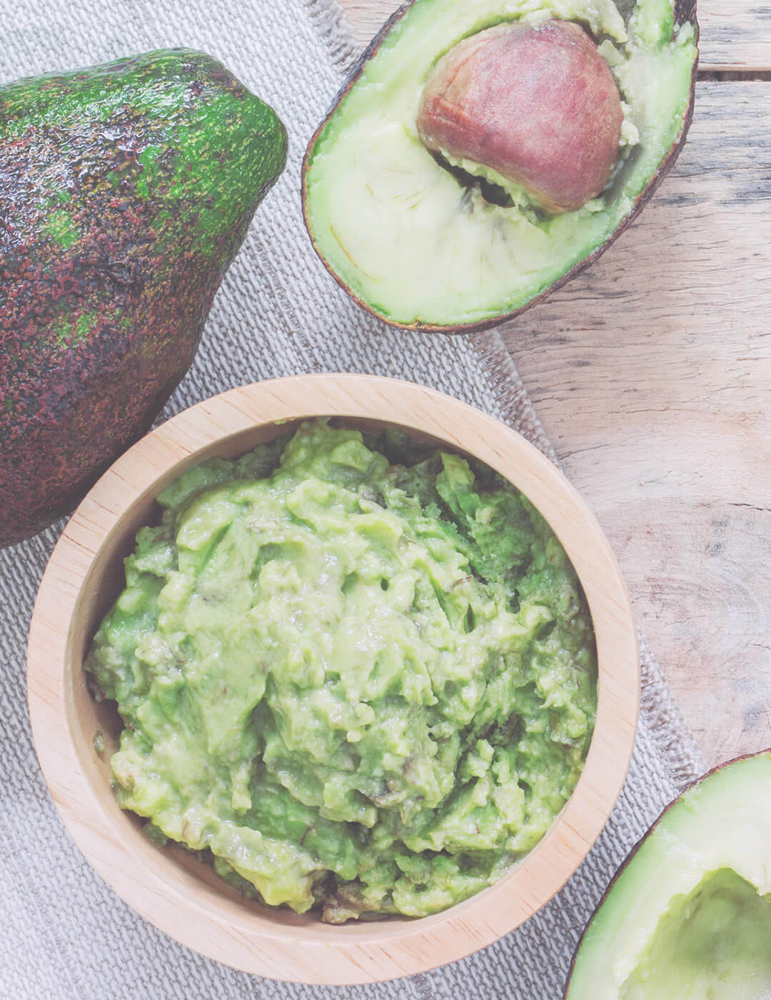 mashed avocado as one of the home remedies for dry and frizzy hair