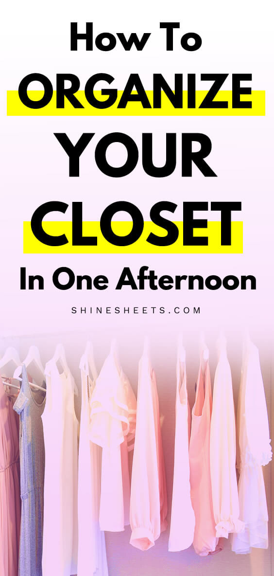 Clothes neatly hanging in the closet on hangers