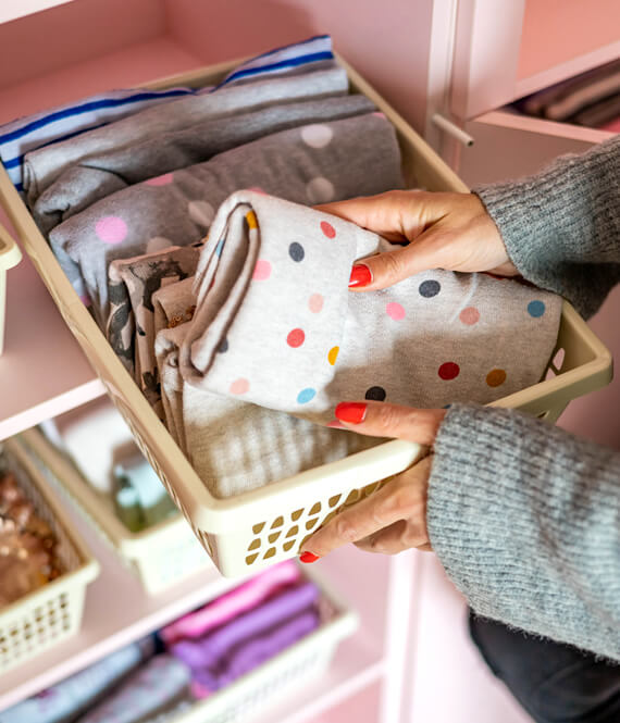woman learning how to organize a closet