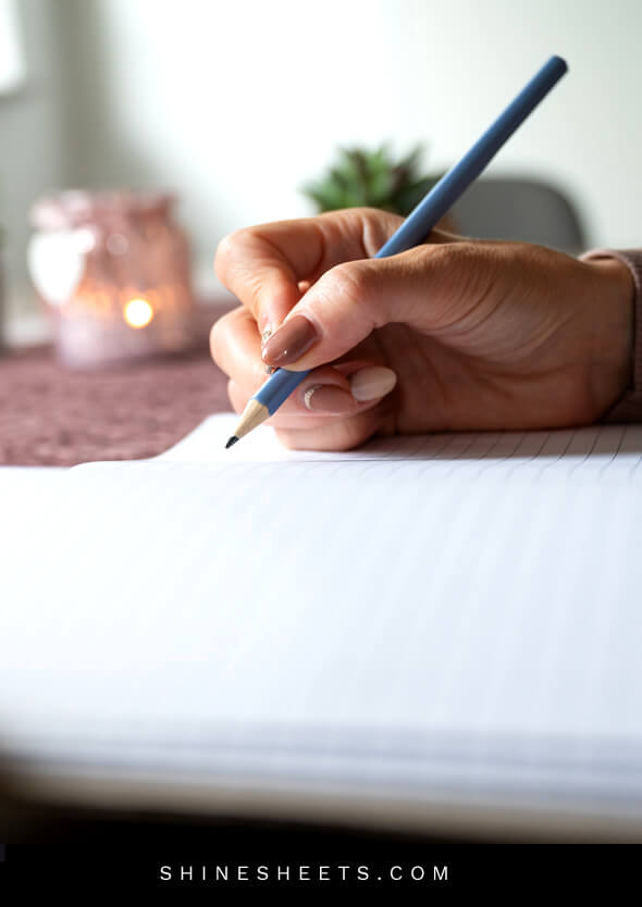 woman writing in a journal to learn how to love yourself