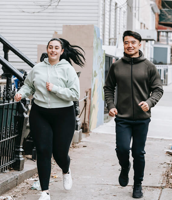 man and woman jogging to start a healthy lifestyle