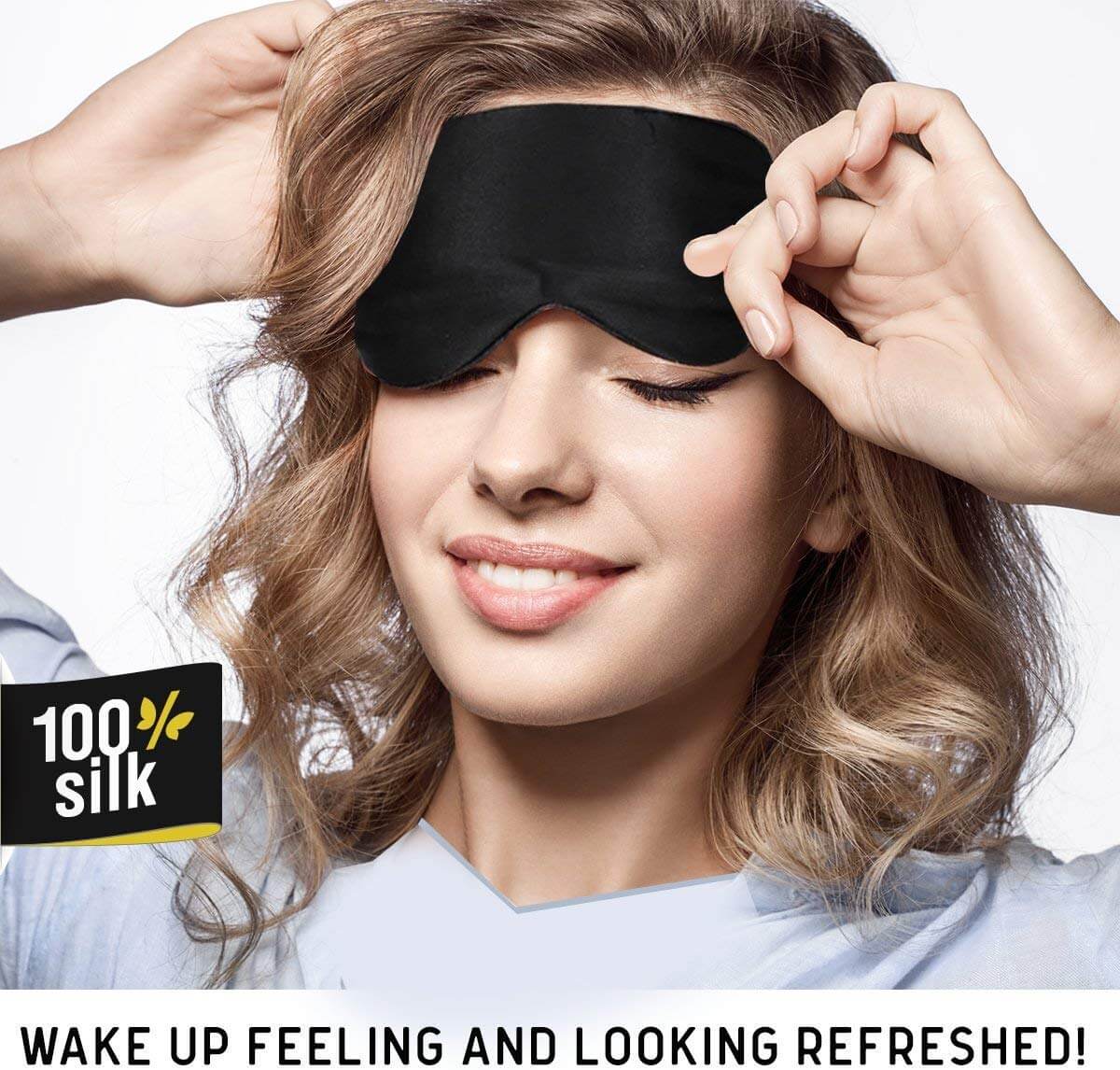 A young girl with brown curly hair is using a black sleep mask
