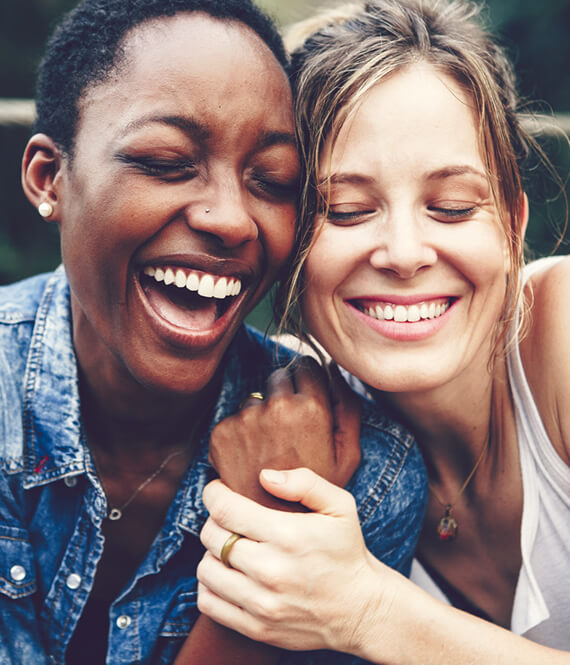 two happy women enjoying life