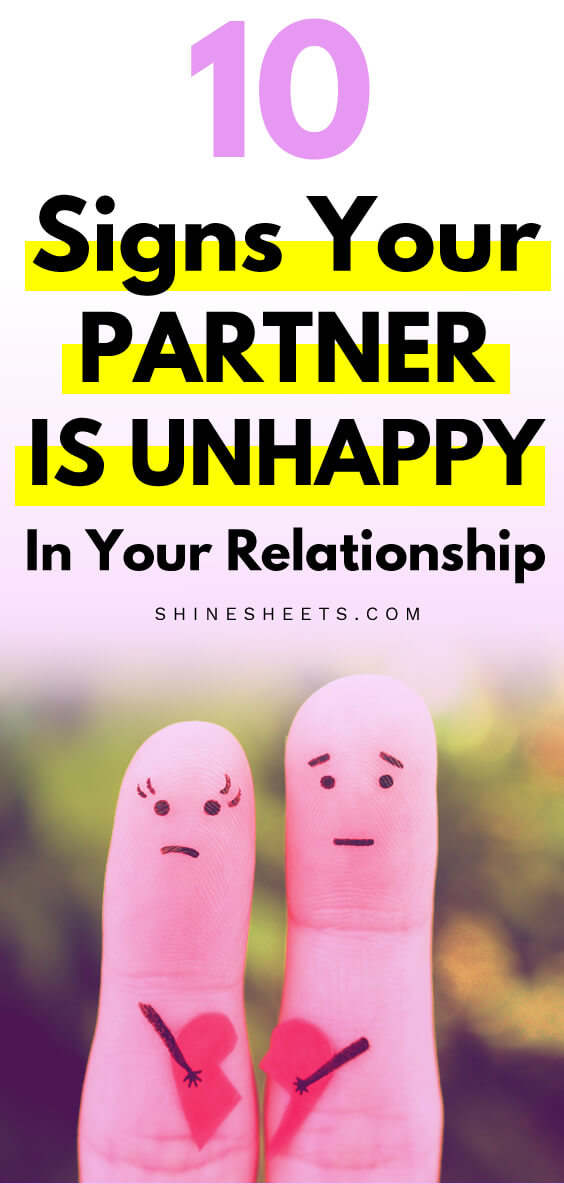 Two fingers painted like an unhappy couple holding a broken heart