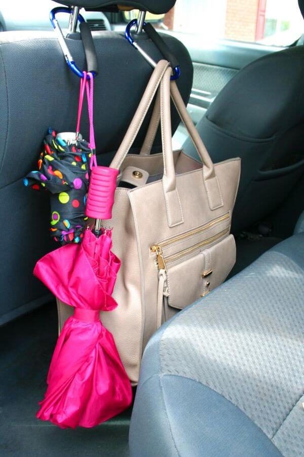 carabineers used as car organization tool to hang bags and umbrellas on the seat