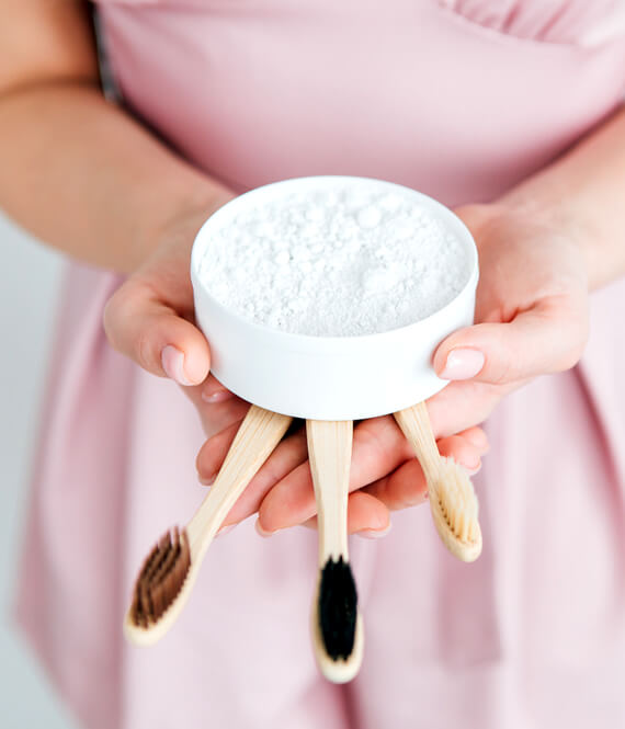 baking soda and bamboo brushes as safe teeth whitening home remedies
