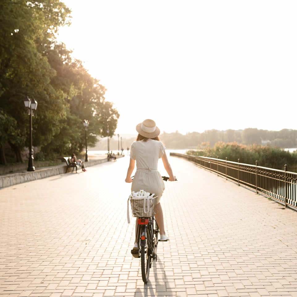 Woman driving on her bicycle in a park