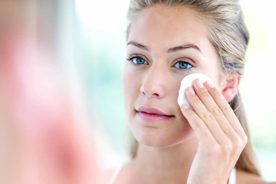 woman removing makeup