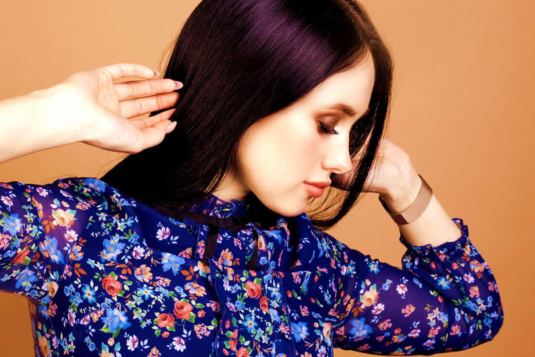 Young brunette woman with long eyelashes