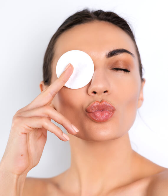 woman using beauty hacks on her face