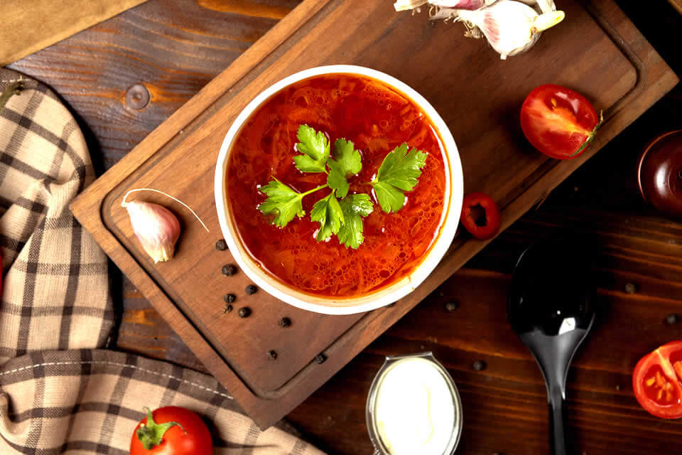 Anti-inflammatory tomato soup on a wooden table