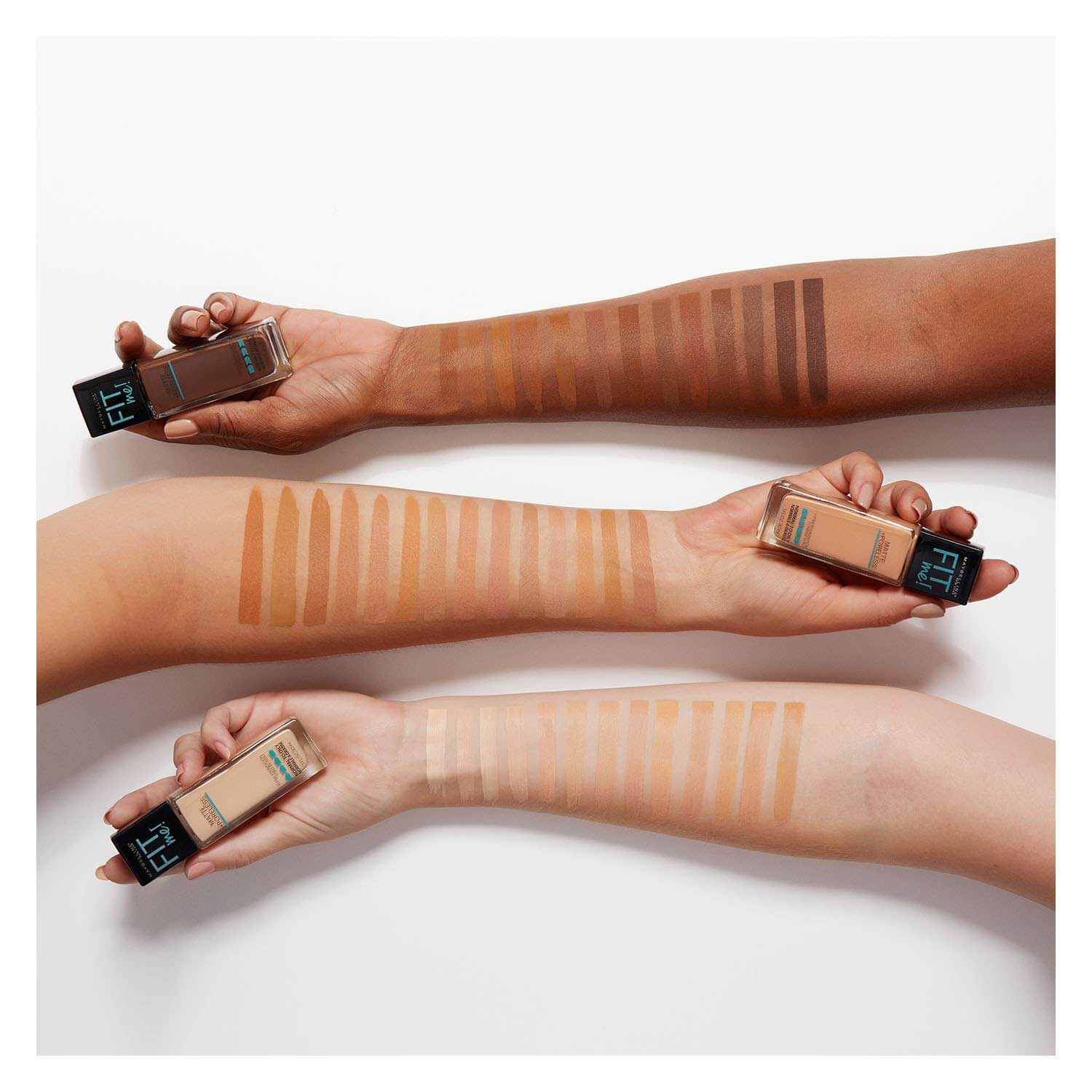 Hands showing range of Maybelline Fit Me foundation shades