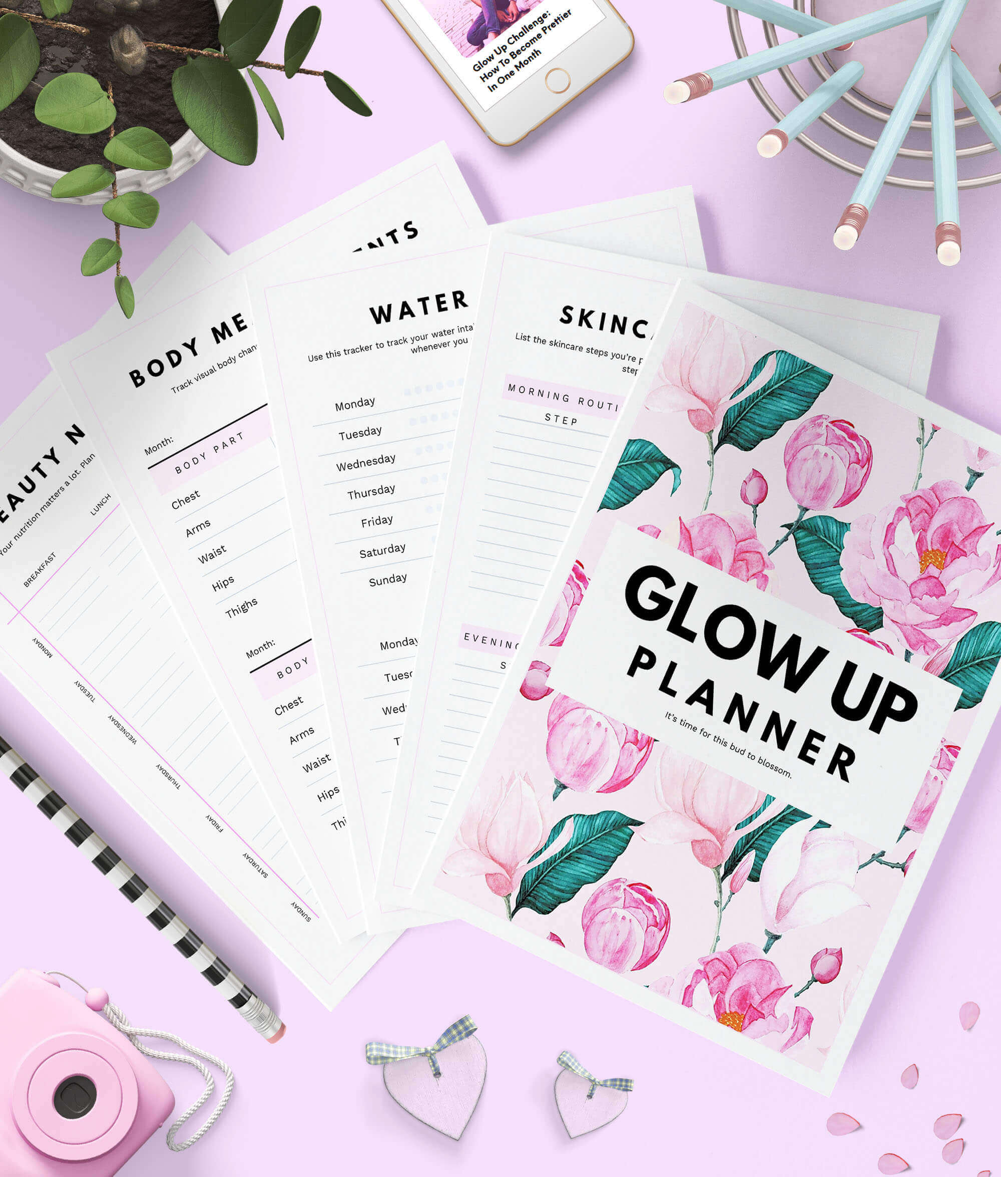 Glow up planner by shinesheets spread out on the table