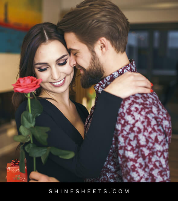 a happy woman receiving a red rose from her loving husband