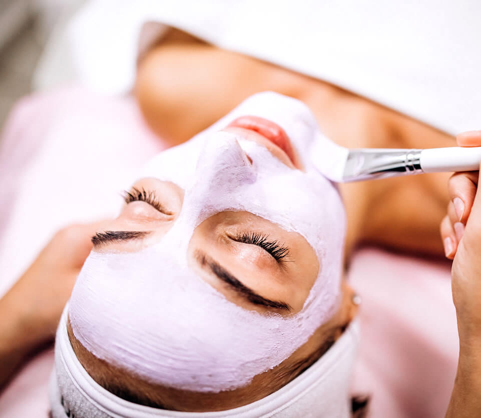 Woman trying out facials for acne at the salon