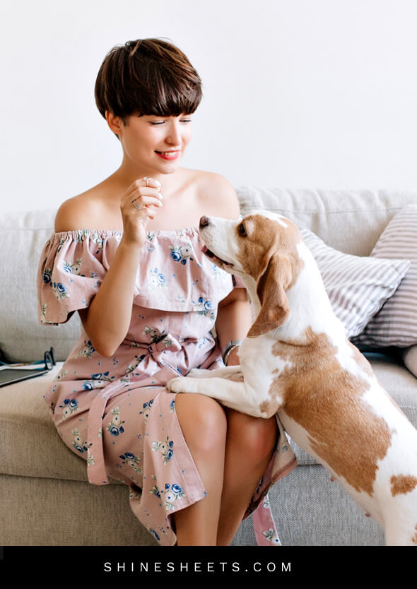 stressed and depressed woman playing with her new adopted dog