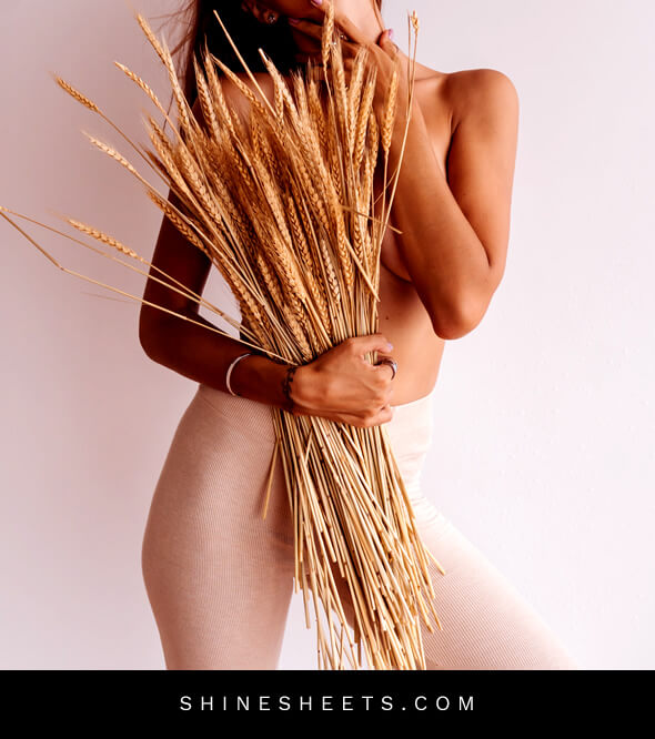 what do men find attractive in women - artistic photography - unrecognizable woman holding straws near a pink wall