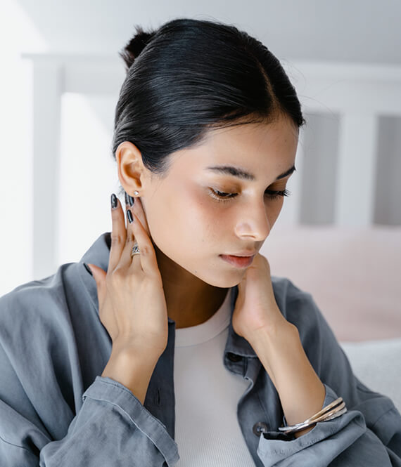 woman having neck pain due to stress and increased blood pressure