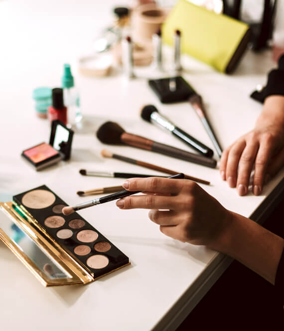 woman using natural eyeshadow palette