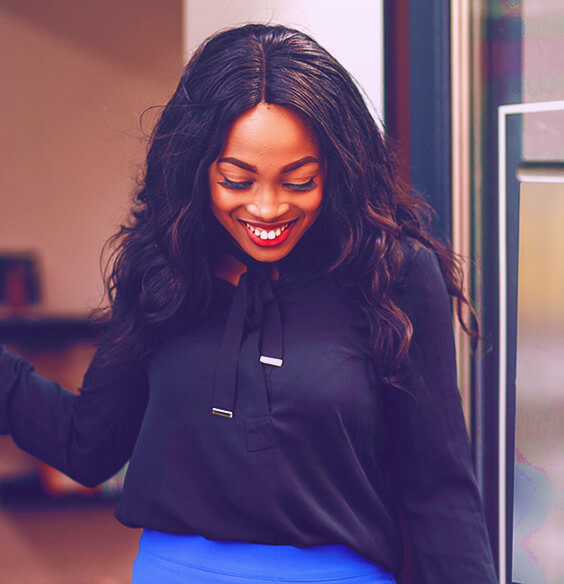 beautiful black woman smiling and looking down confidently