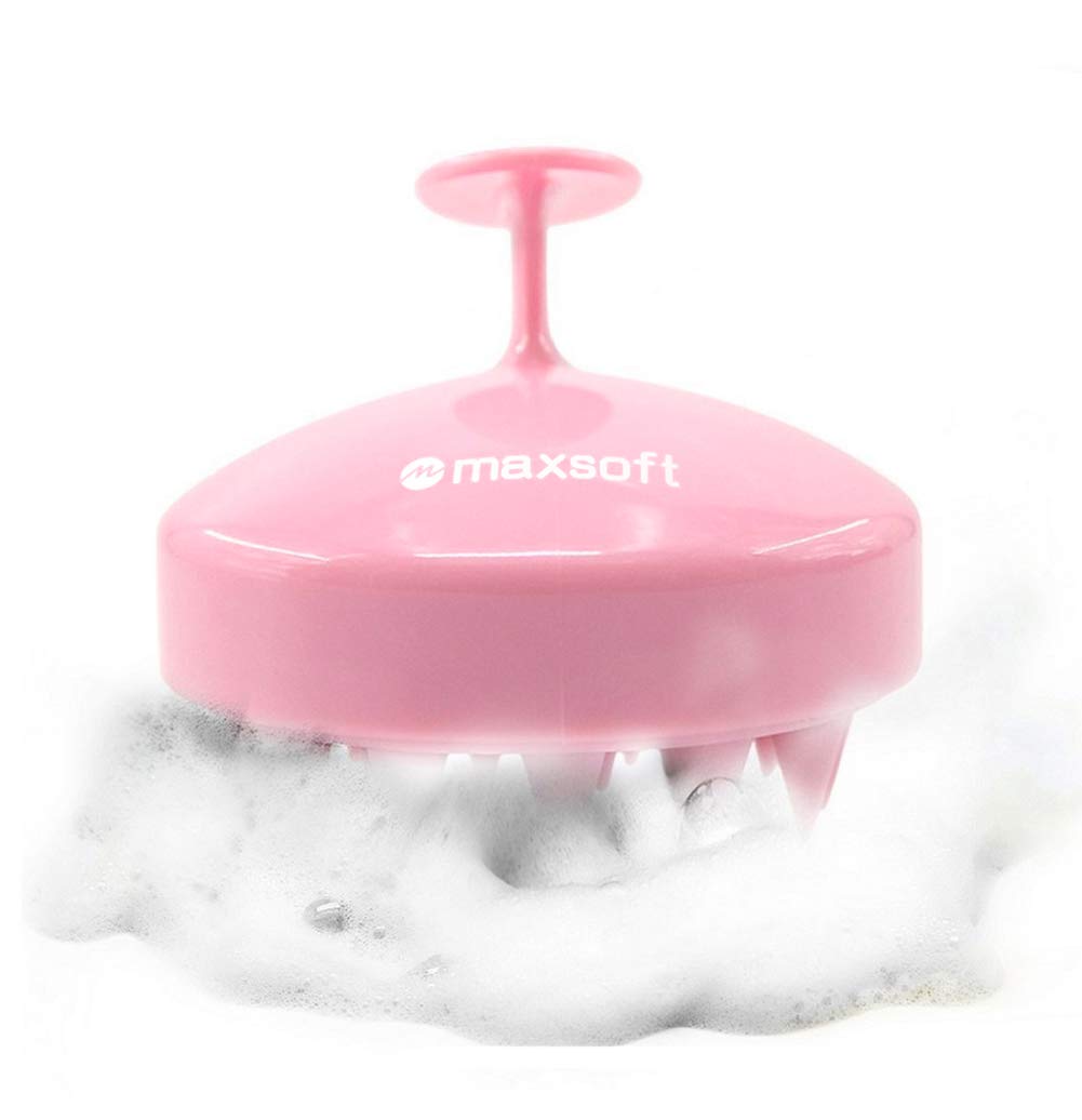 Pink scalp massager showed in action as one of the tips for healthy hair
