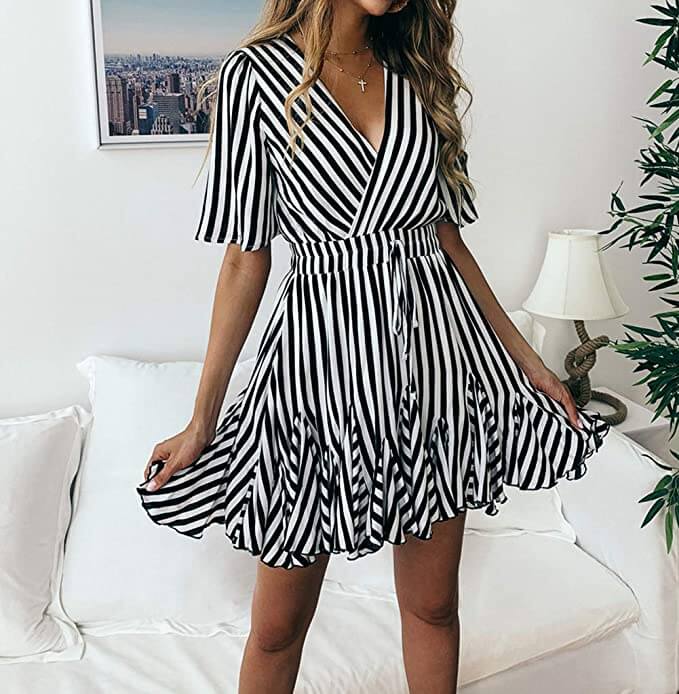Tanned blond girl shows how to be pretty with monochrome dress