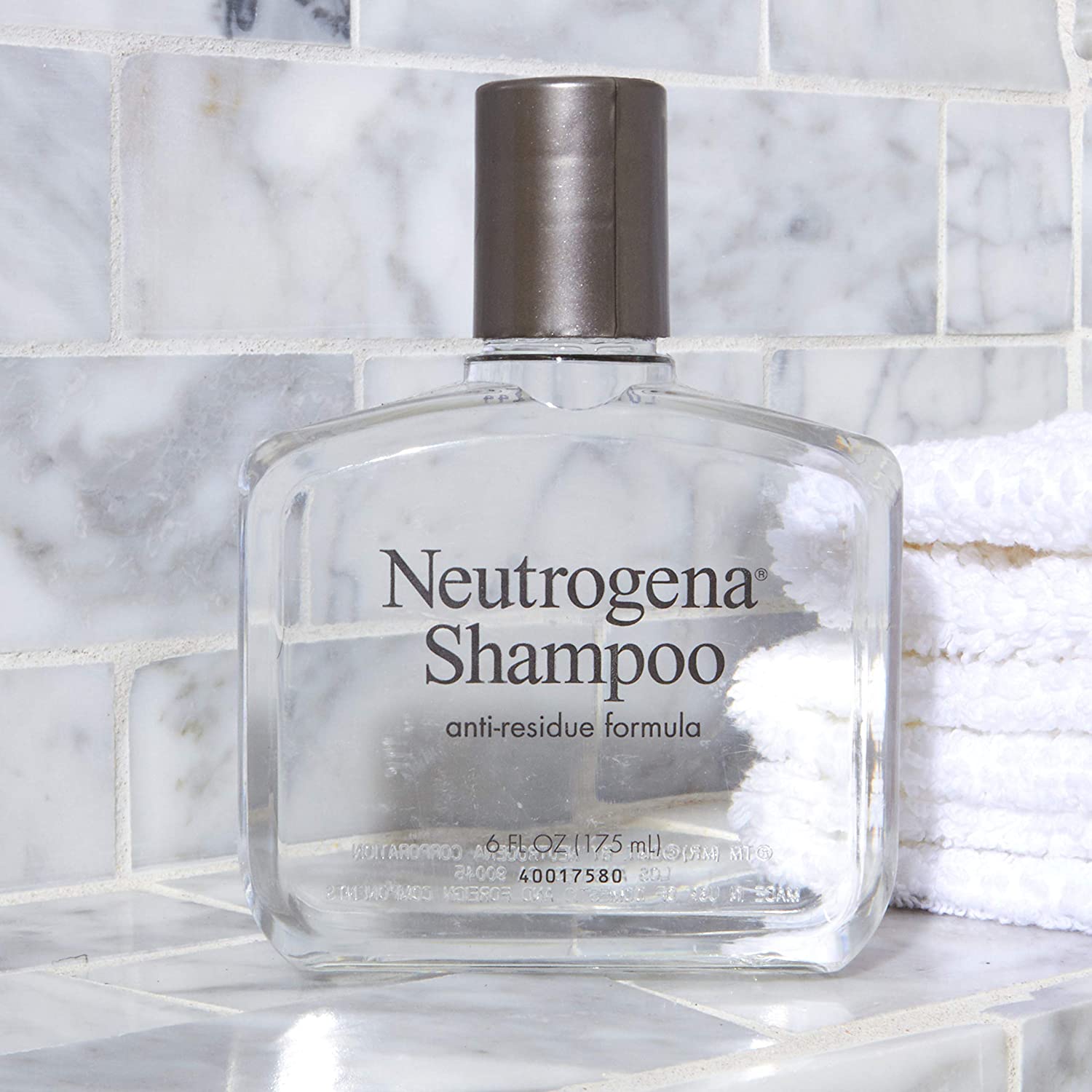 Neutrogena clarifying shampoo on bathroom shelf as one of the tips for healthy hair