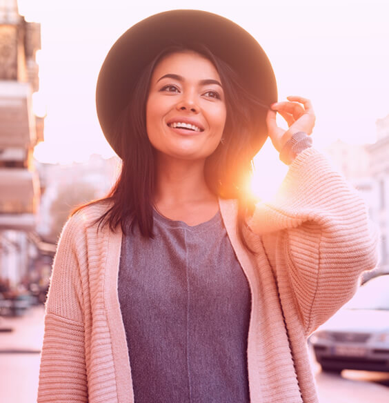 Brunette woman in the sunset practicing self love