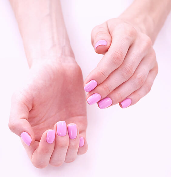 Brittle nails shown painted with pink nail polish