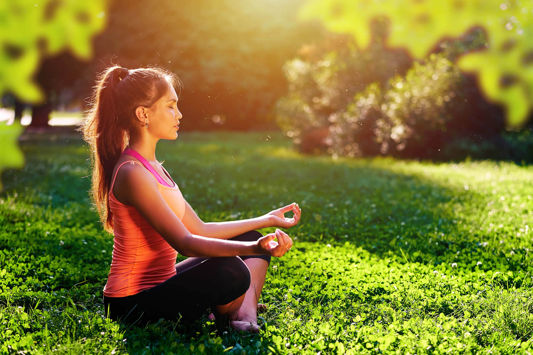 woman meditating in nature to overcome anxiety