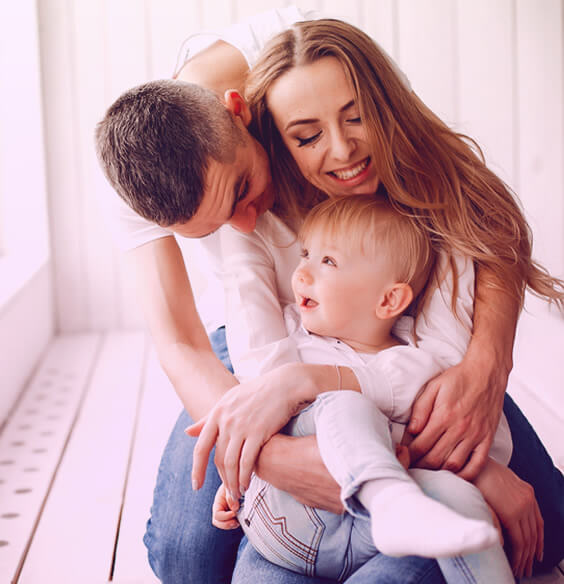 happy couple and a baby spending time with family