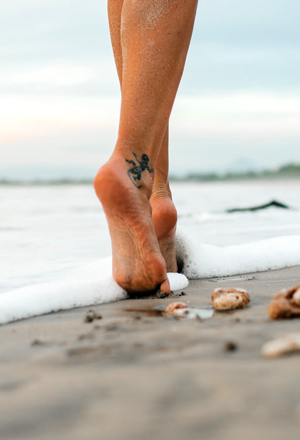 woman walking at the beach