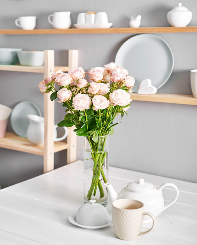 cheap home decor plates and flowers on shelf