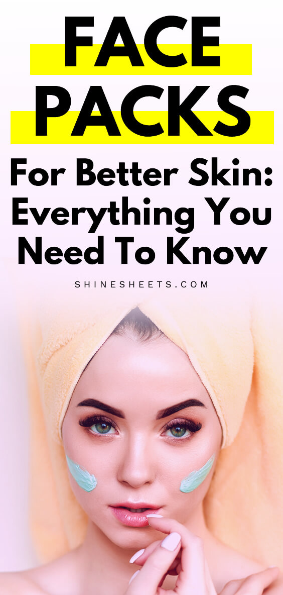 young woman using green face pack on her face